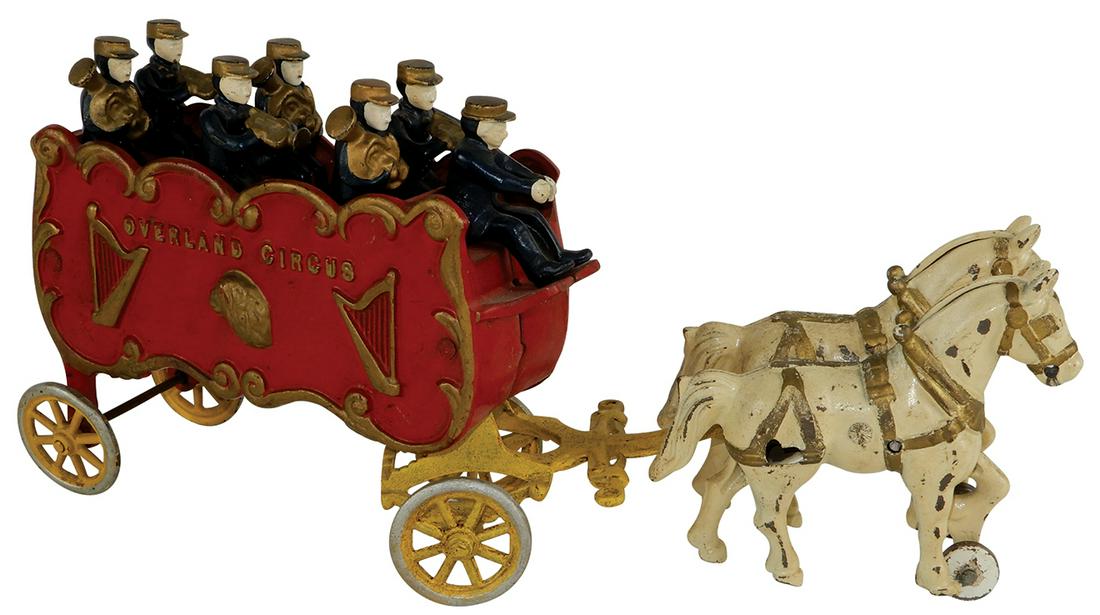 Toy Kenton Overland Circus Band Wagon, horse-drawn: Toy Kenton Overland Circus Band Wagon, horse-drawn w/driver & six band members, cast iron w/orig paint, c.1930's, horse team has broken end on connecting bolt, o/wise Exc cond, 15.5"L.