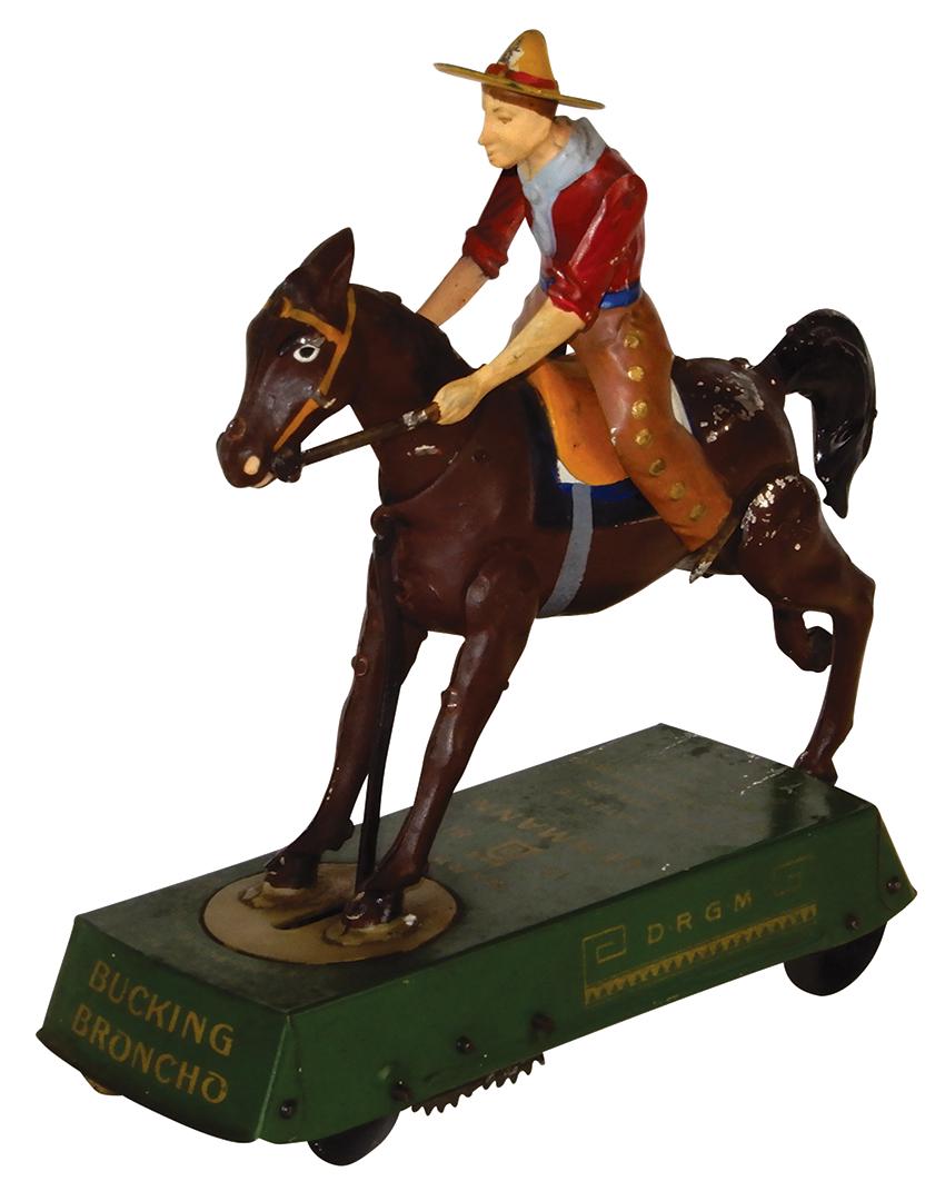 Toy Lehmann Bucking Broncho, Made in Germany, litho on: Toy Lehmann Bucking Broncho, Made in Germany, litho on tin windup, minor paint loss where horse hooves kick base & cowboy's feet hit horse, o/wise Exc working cond, 6.75"H x 7.75"L.