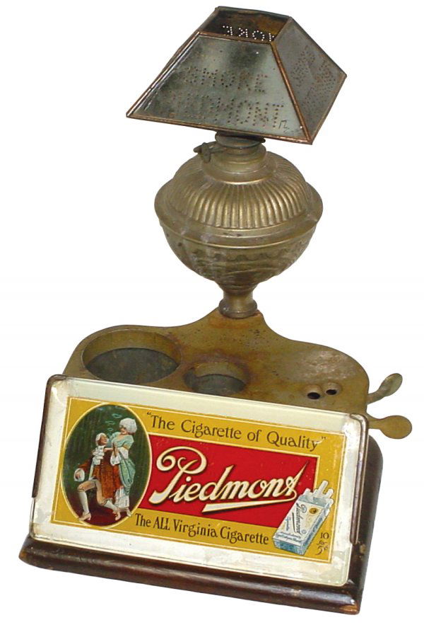 Cigar lighter & cutter, Piedmont-The Cigarette of: Cigar lighter & cutter, Piedmont-The Cigarette of Quality, made by Brunhoff Mfg Co-Cincinnati, glass front has chip on one corner & flaking paint on white border, orig pierced tin Smoke Piedmont adv s