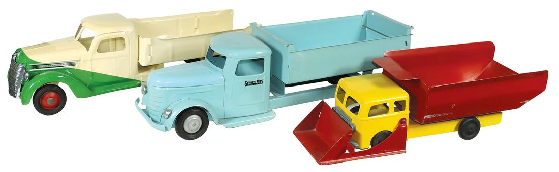 Toy Trucks (3), Buddy L 2-tone stake bed, Structo dump: Toy Trucks (3), Buddy L 2-tone stake bed, Structo dump bed & a Roberts dump truck/loader, all repainted pressed steel in VG to Exc cond, largest 22"L.