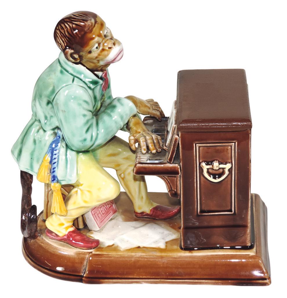 Black Americana, Majolica humidor, Sarreguemines Monkey: Black Americana, Majolica humidor, Sarreguemines Monkey seated at organ, marked Majolica No. 231 on bottom, Exc cond w/added wooden organ lid, 9.5"H x 9"W.