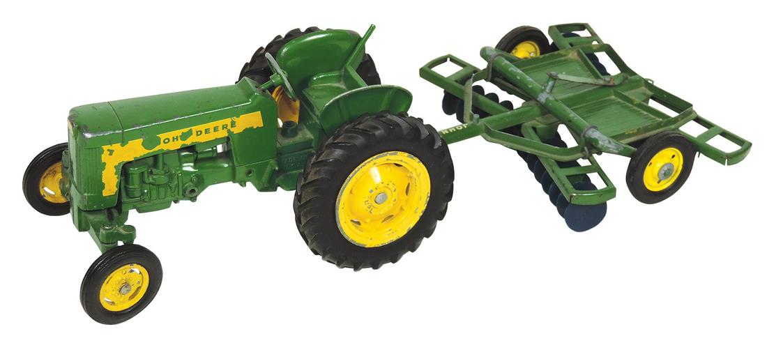 Farm Toys (2), John Deere 430 tractor & disk, 1:16: Farm Toys (2), John Deere 430 tractor & disk, 1:16 Scale Ertl, tractor has 3-point hitch & fancy old style rear & front rims, c.1950's, a Rare tractor w/some decal & paint loss, o/wise Exc cond & John