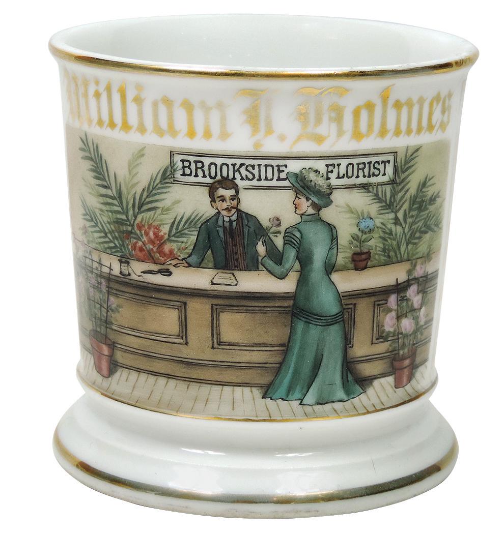 Occupational Shaving Mug, Florist, Shop Interior of: Occupational Shaving Mug, Florist, Shop Interior of "Brookside Florist", man assisting lady at counter, colorful well executed image, bottom stamped CFH over GDM France, personalized William F. Holmes