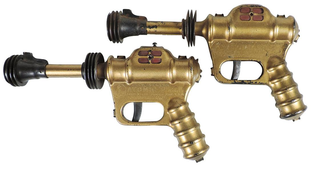 Toy Pistols (2), Buck Rogers Atomic Pistols, mfgd by: Toy Pistols (2), Buck Rogers Atomic Pistols, mfgd by Daisy Mfg, working mechanisms w/orig paint, one VG cond, other Good, both 10"L.