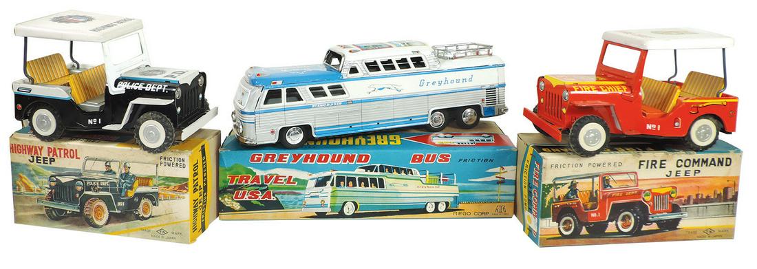 Toy Vehicles in Boxes (3), TN & Mego Japan Highway: Toy Vehicles in Boxes (3), TN & Mego Japan Highway Patrol Jeep, c.1960's, Fire Command Jeep & Greyhound Bus, all litho on tin friction in Exc to Near-Mint cond, largest 12"L.