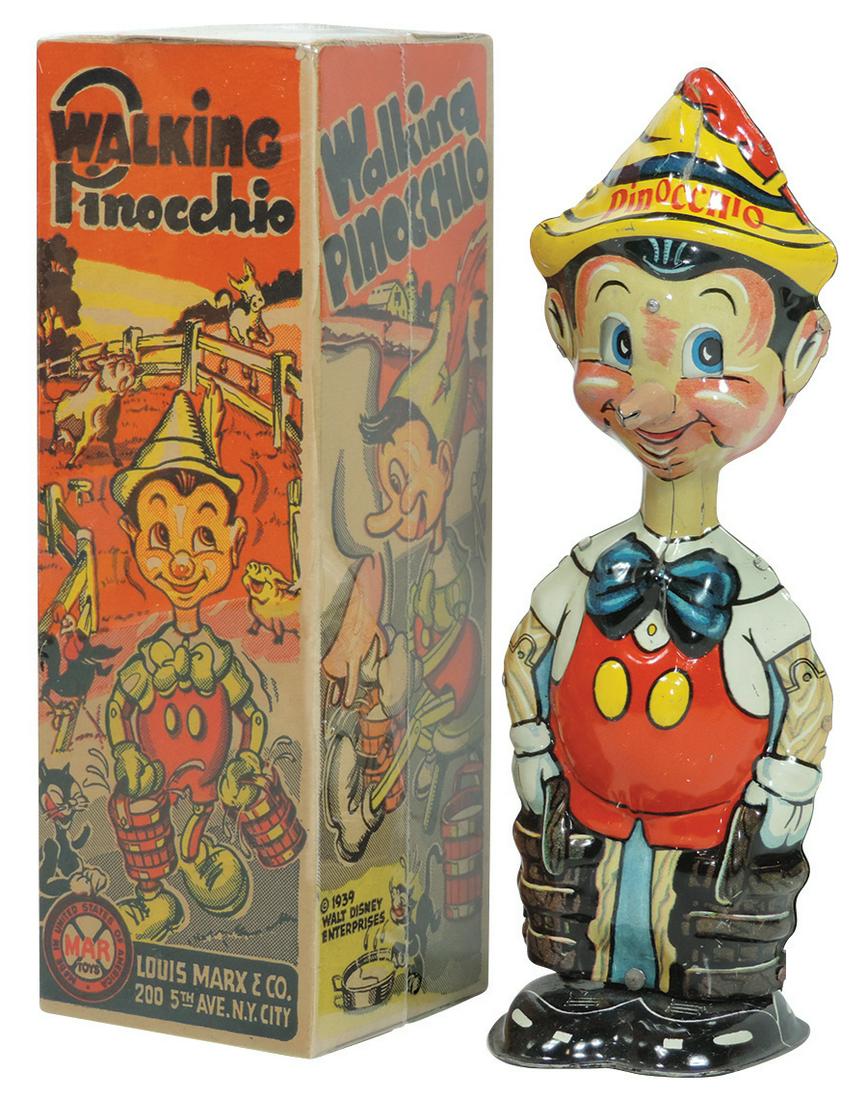 Toy Walking Pinocchio w/orig box, Marx litho on tin: Toy Walking Pinocchio w/orig box, Marx litho on tin windup marked Walt Disney Enterprises 1939, eyes move up & down as he walks forward, Near-Mint working cond w/Exc cond shrink-wrapped box, 8.5"H.