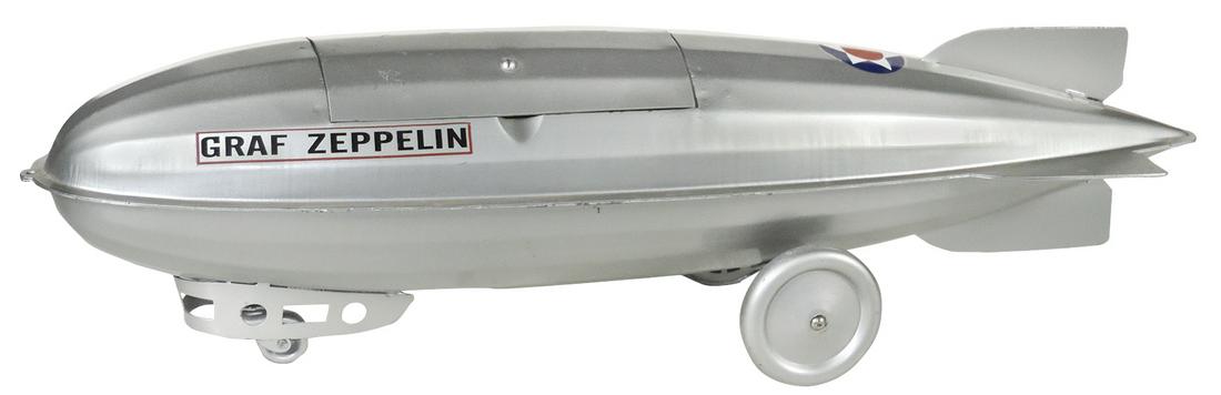 Toy Steelcraft Zeppelin Pull Toy, 1930’s pressed steel,: Toy Steelcraft Zeppelin Pull Toy, 1930’s pressed steel, Scarce storage compartment version w clicker wheel, VG cond w/an older restoration, 7"H x 5.5"W x 26"L.