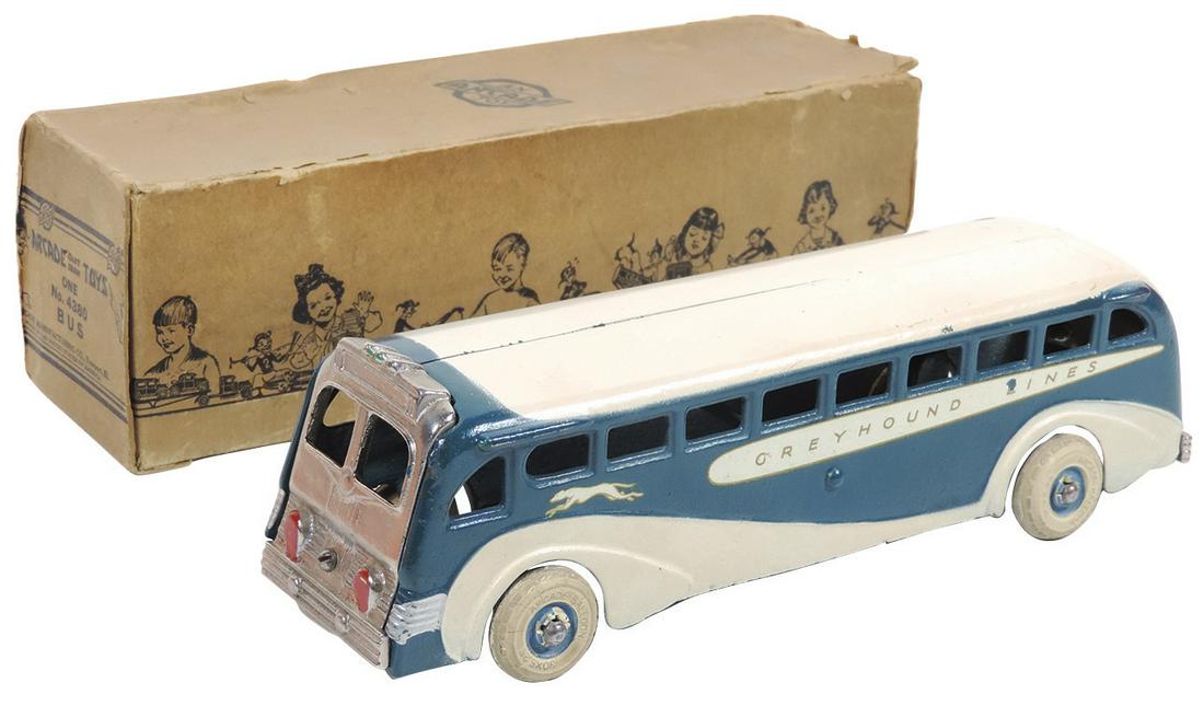 Toy Greyhound Bus in orig box, Arcade #4380, cast iron,: Toy Greyhound Bus in orig box, Arcade #4380, cast iron, c.1937, Exc to Near-Mint cond, with a couple of paint & decal nicks, box missing end flaps on one end, 9"L.
