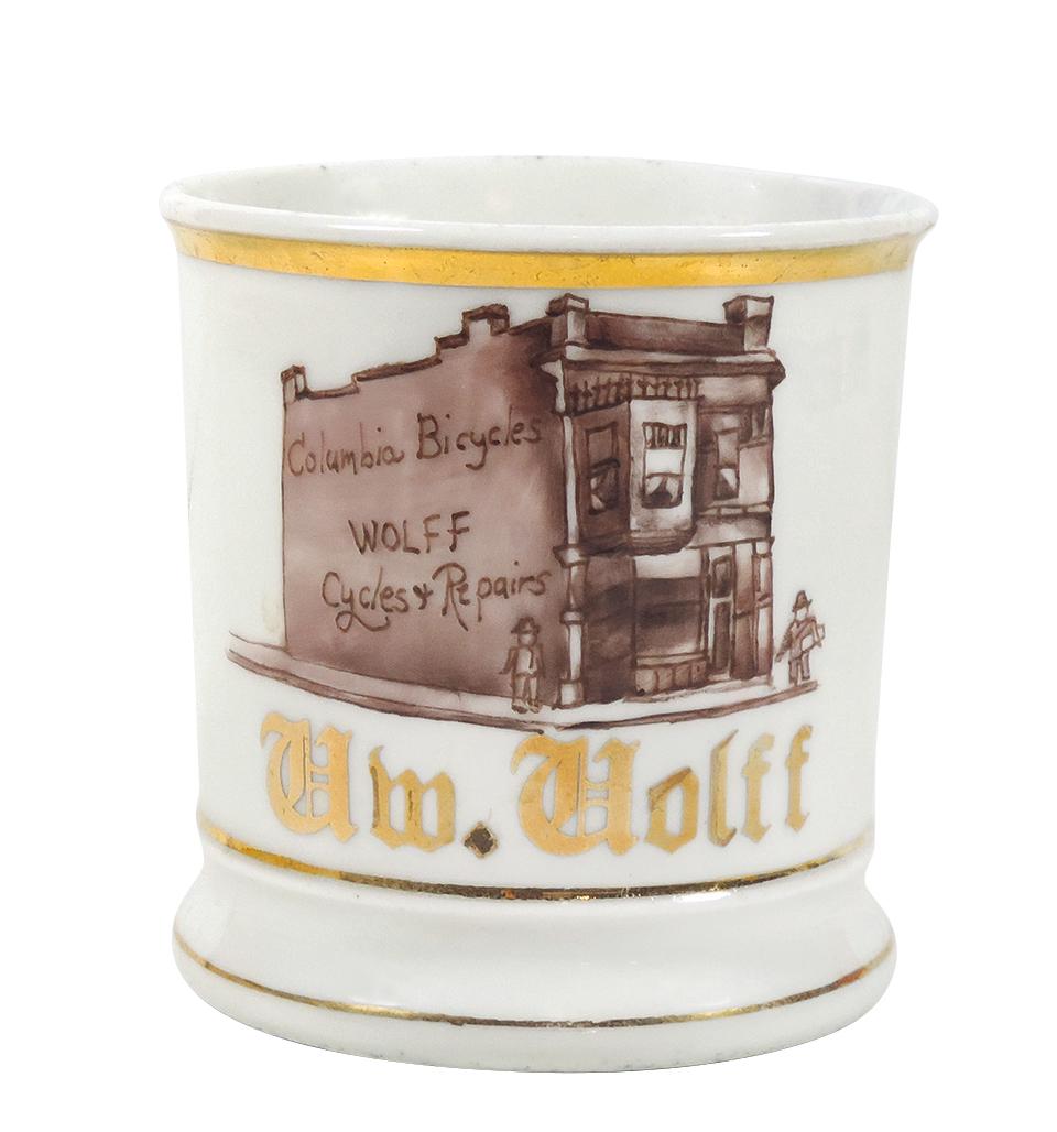 Occupational Shaving Mug, Columbia Bicycles-Wolff: Occupational Shaving Mug, Columbia Bicycles-Wolff Cycles & Repairs, personalized Wm. Wolff, early hand-painted Bicycle-Motorcycle shop, Near-Mint cond w/no loss on gold trim, 4"H.