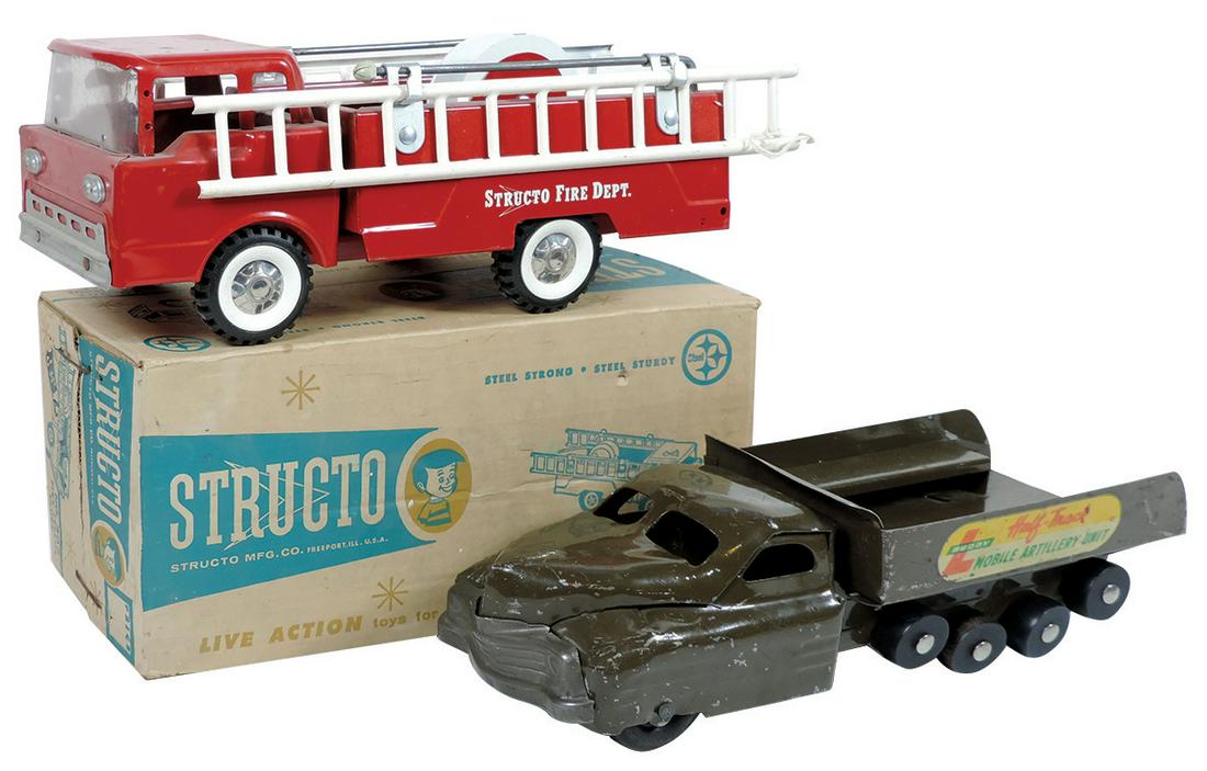 Toy Vehicles (2), Structo #307 Fire engine, Exc cond in: Toy Vehicles (2), Structo #307 Fire engine, Exc cond in orig box w/unassembled attachments, hose absent & Buddy L Mobile Artillery Unit, Good to VG cond w/missing tracks, 5.5"H x 6"W x 12.5"L.