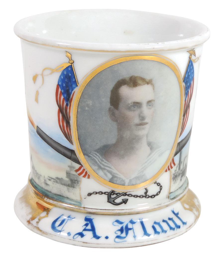Occupational Shaving Mug, Photographic, Sailor, colored: Occupational Shaving Mug, Photographic, Sailor, colored photo surrounded by flags, cannons & ships, bottom stamped W.G.& Co.-Limoges France, personalized C.A. Flaut, Exc cond w/some wear on gold bands