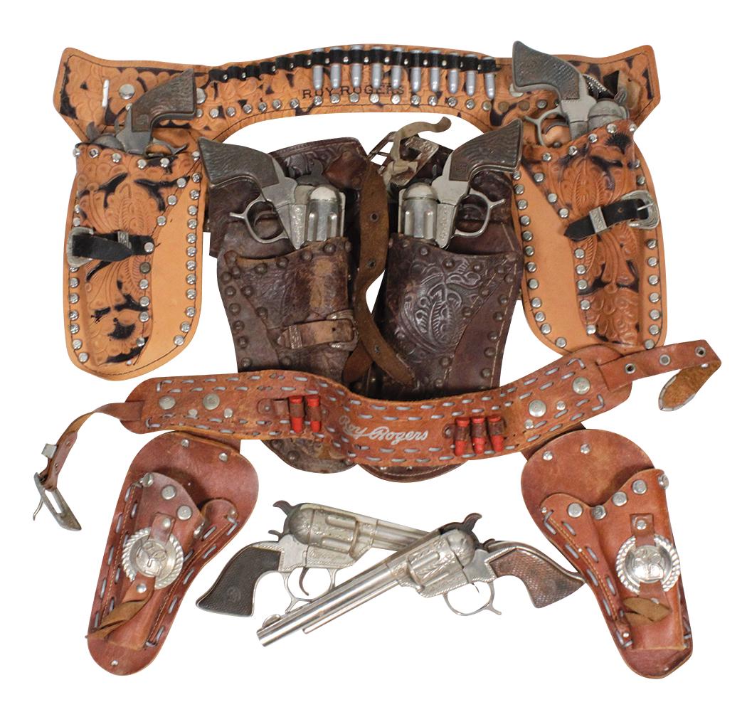 Western Cowboy Roy Rogers double holder sets (3), each: Western Cowboy Roy Rogers double holder sets (3), each w/six shooter cap guns in leather holsters w/belts, 2 w/embossed tooled decoration, one with RR Conchos, Good cond overall with various levels of