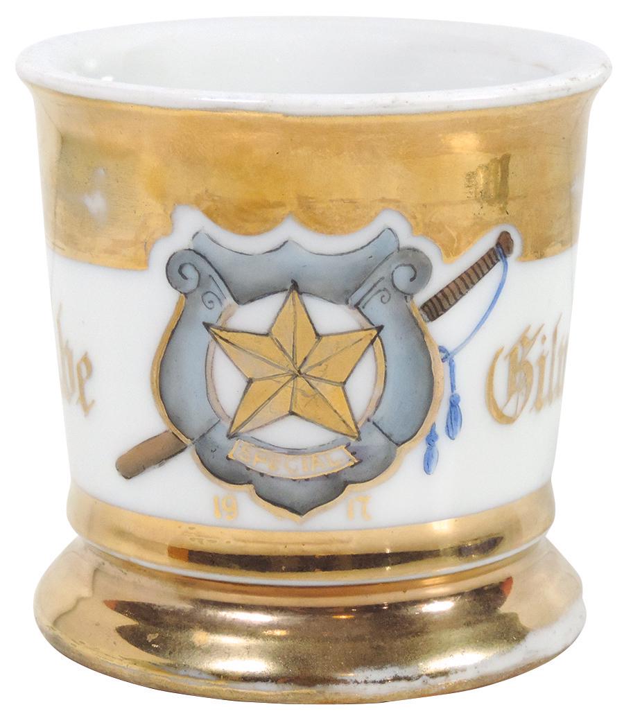 Occupational Shaving Mug, Police Badge marked "Special": Occupational Shaving Mug, Police Badge marked "Special" w/night stick, dated 1917, bottom stamped Austria & signed by decorator, personalized Abe Gilman w/gold wrap, Exc cond w/some wear on gold bands