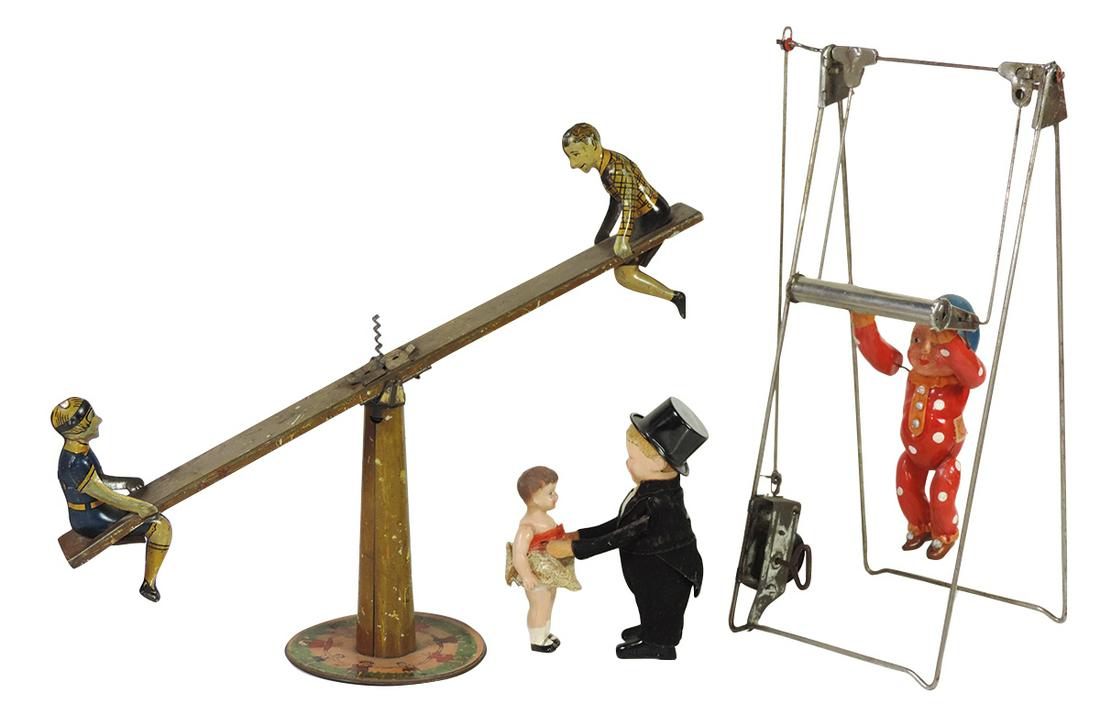 Toys (3), Schuco windup, man in fabric tuxedo & top hat: Toys (3), Schuco windup, man in fabric tuxedo & top hat lifts up young celluloid girl, Exc working cond but no key, celluloid windup clown acrobat tumbler, works perfectly, appears to have dent above