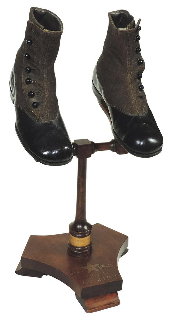Shoe Store Display Stand w/Shoes, Wooden "Star Brand": Shoe Store Display Stand w/Shoes, Wooden "Star Brand" shoe display stand w/a pair of Buster Brown "TumbleAbout" child's NOS high-top button shoes, Exc cond, 12"H x 8"W x 7"D.