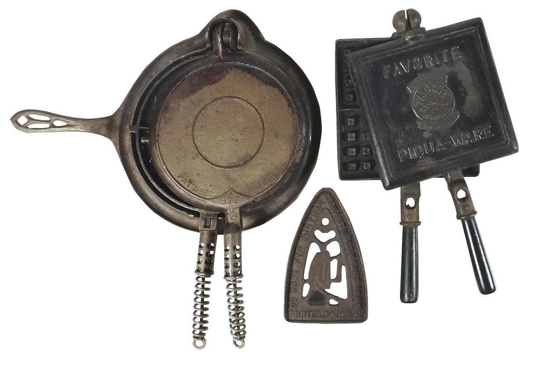 Kitchenware (3), cast iron waffle irons & trivet,: Kitchenware (3), cast iron waffle irons & trivet, "Favorite Stoves" Piqua-Ware, #8 Griswold & a Straube Gas Iron "I Wantu" trivet, all in Good cond w/orig finishes, largest 17"L x 15"W.