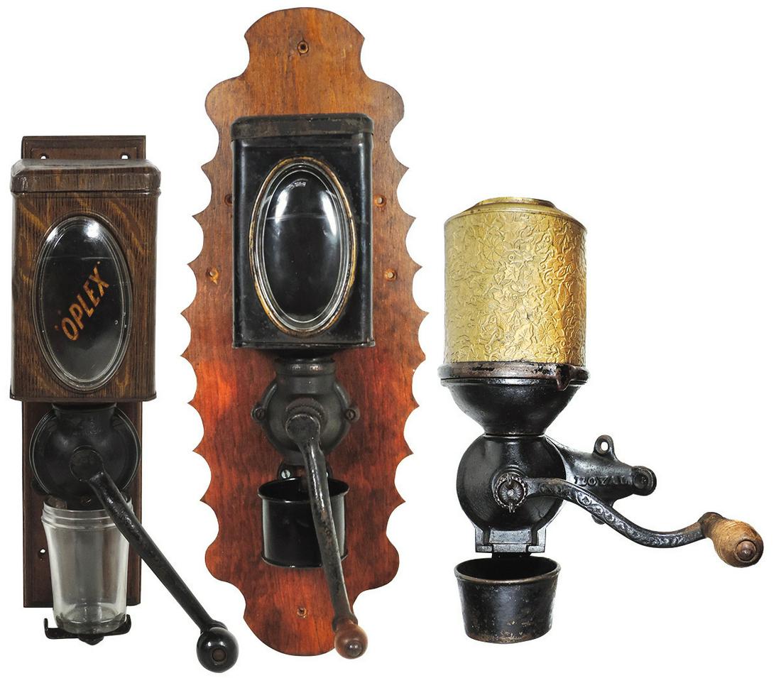 Coffee Grinders (3) "Mahogany", oval glass inset: Coffee Grinders (3), "Mahogany", oval glass inset w/decal labels, "Duplex", wood-grained litho on tin w/oval glass insert & "Royal" w/floral embossed brass canister, all wall mount in VG cond, largest