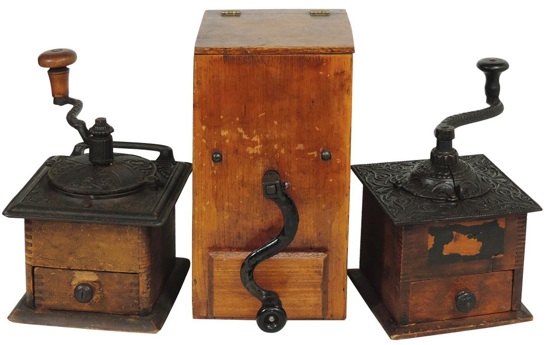 Coffee Grinders (3), table top styles in wood, two: Coffee Grinders (3), table top styles in wood, two w/ornate cast iron tops & a Mid-Century primitive wood mill, all VG to Exc cond, largest 11"H x 6"Sq.