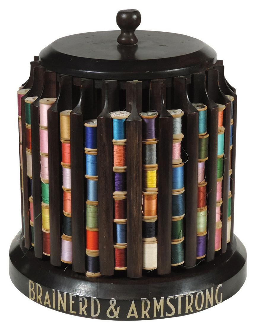 Country Store Brainerd & Armstrong Spool Case, wood: Country Store Brainerd & Armstrong Spool Case, wood carousel w/24 conforming vertical slots & lettering on base, complete w/spools as shown, VG to Exc cond, 13"H x 12"Dia.