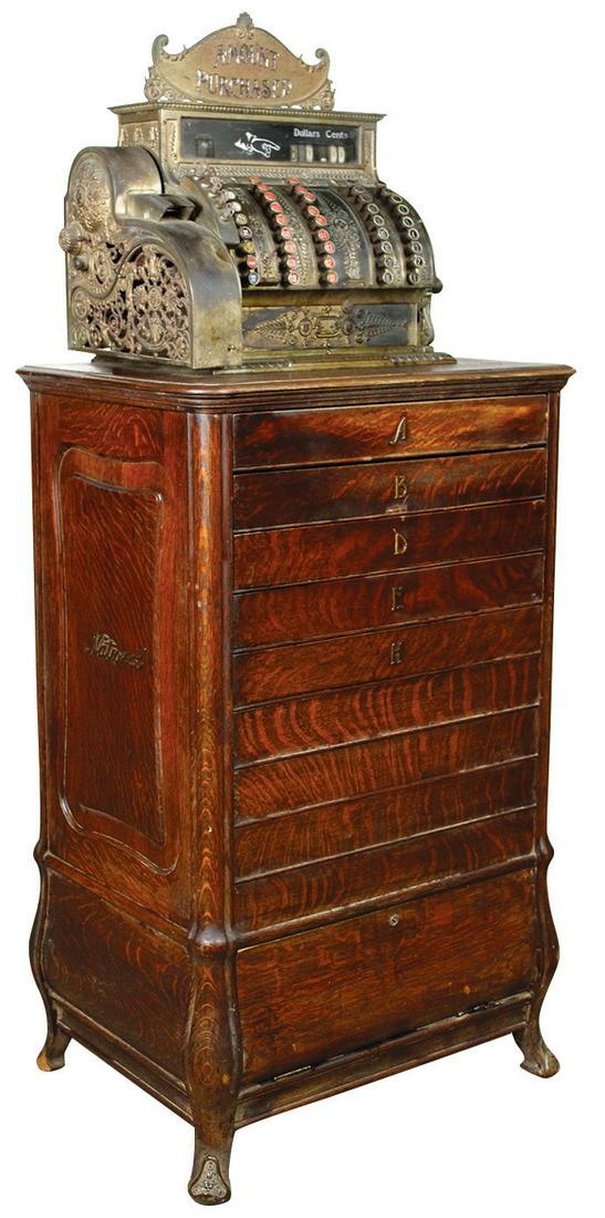 National Cash Register Floor Model 95, oak 9-drawer: National Cash Register Floor Model 95, oak 9-drawer base w/"Amount Purchased" marquee, Good orig untouched cond w/orig finish, crank opens 1 drawer but most keys frozen, some loss on bottom of rear le