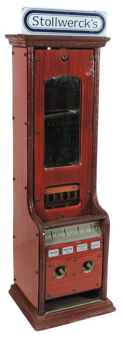 Coin-Operated Machine, Stollwerck 4-column 1 Cent: Coin-Operated Machine, Stollwerck 4-column 1 Cent vendor for gum & chocolate, L-shaped wood cabinet w/faux grain painted metal panels, has porcelain top sign, mfgd by Stollwerck Bros.-New York & Chica