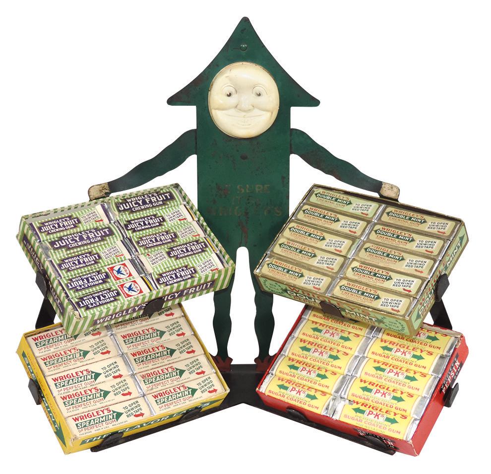 Chewing Gum Counter Display, Wrigley's Gum, 1920: Chewing Gum Counter Display, Wrigley's Gum, 1920's Spearmint tin figure w/celluloid face, holds 4 display boxes w/product, Good to VG cond w/paint wear, celluloid face slightly depressed w/small crack