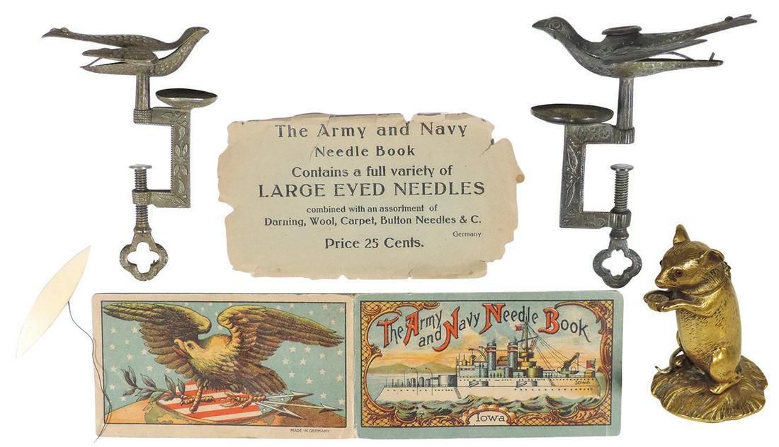 Victorian Sewing Notions (5), gilt bronze figural mouse: Victorian Sewing Notions (5), gilt bronze figural mouse thread holder w/ruby eyes, 2 brass/bronze sewing bird clamps, "Iowa" battleship needle book & celluloid tatting shuttle, all VG & Exc cond, larg