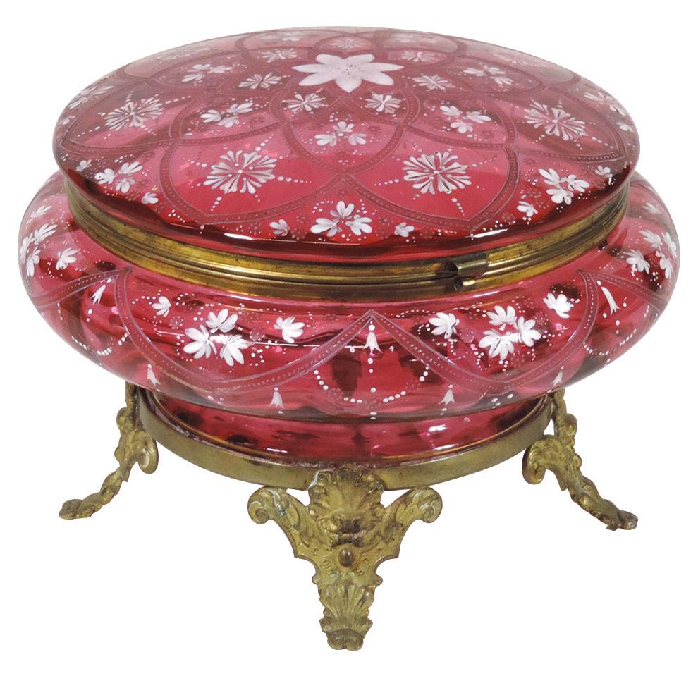 Art Glass, Bohemian cranberry glass dresser box: Art Glass, Bohemian cranberry glass dresser box w/enameled decoration on ormolu footed base, probably made by Moser, VG cond, 6.5"H x 8.5"Dia.
