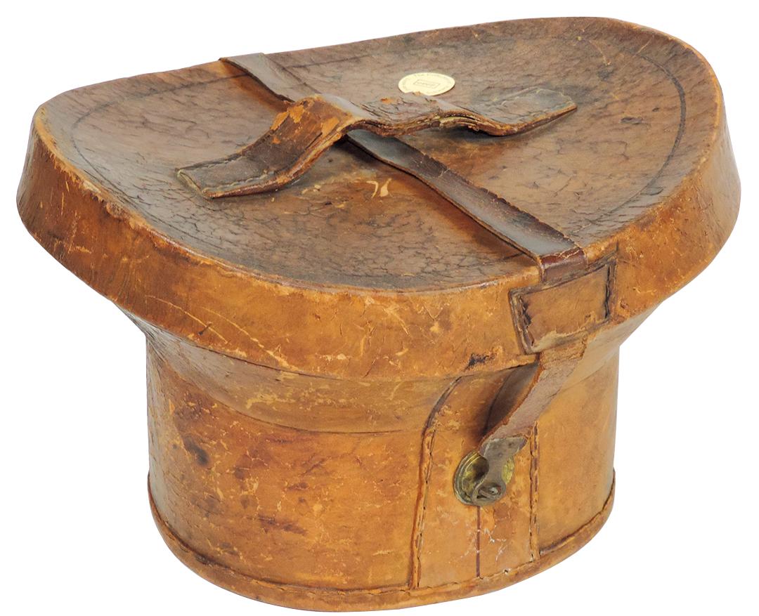 Victorian Fashion & Vanity, Leather Top Hat Carrying: Victorian Fashion & Vanity, Leather Top Hat Carrying Case, Circa 1840 w/handle, gilt brass clasp & seersucker lining, Good to VG cond w/surface checking , 9"H x 14"W x 12"D.