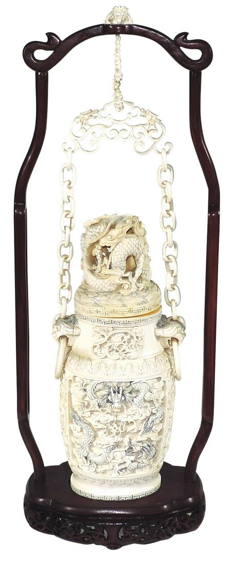 Decorative Chinese Carved Hanging Lidded Urn,: Decorative Chinese Carved Hanging Lidded Urn, c.1910, carved in fine detailed relief w/scenic panels of Dragons, open work carved dragons on domed cover & mythical beast handles, carved chains hanging