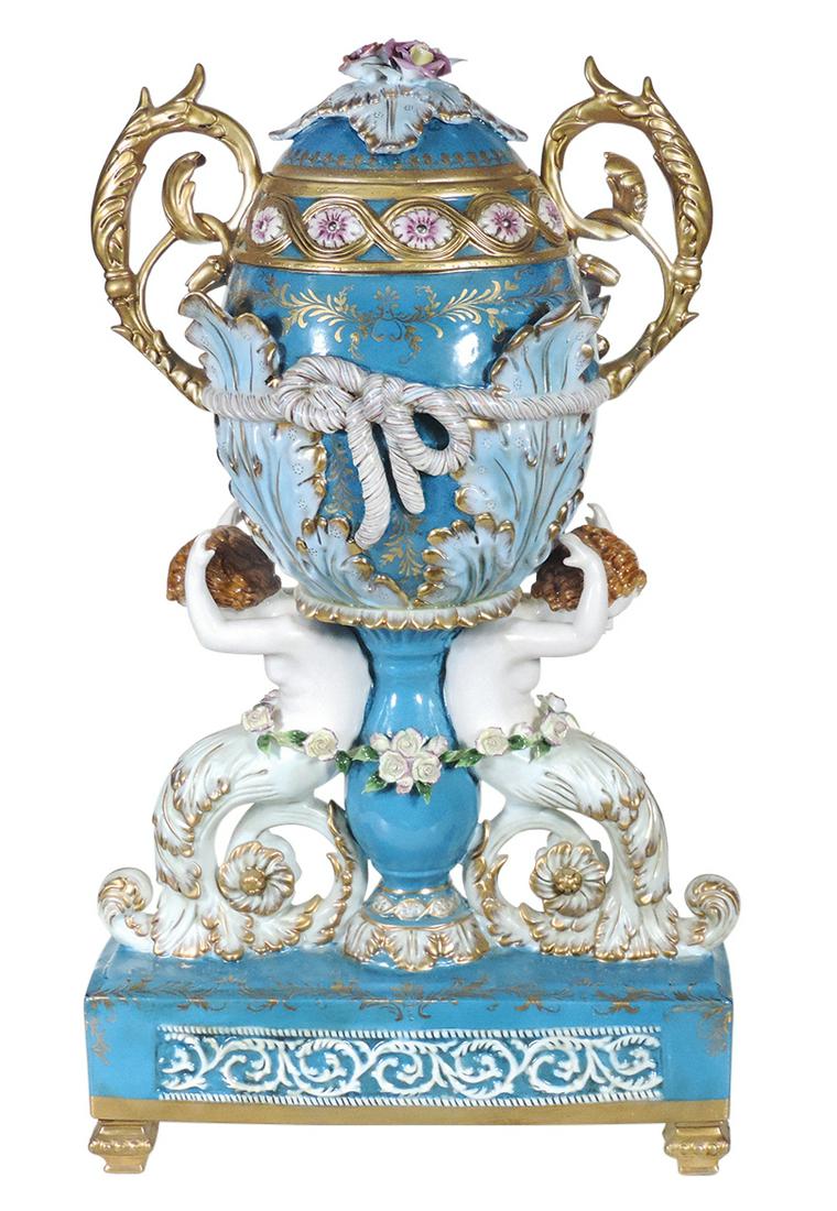 Decorative Sevres Style Porcelain Figural Urn, 20th: Decorative Sevres Style Porcelain Figural Urn, 20th Century scroll handled egg form lidded urn w/large tied acanthus in relief, supported by floral draped Caryatids on a bleu celeste ground, Richard K