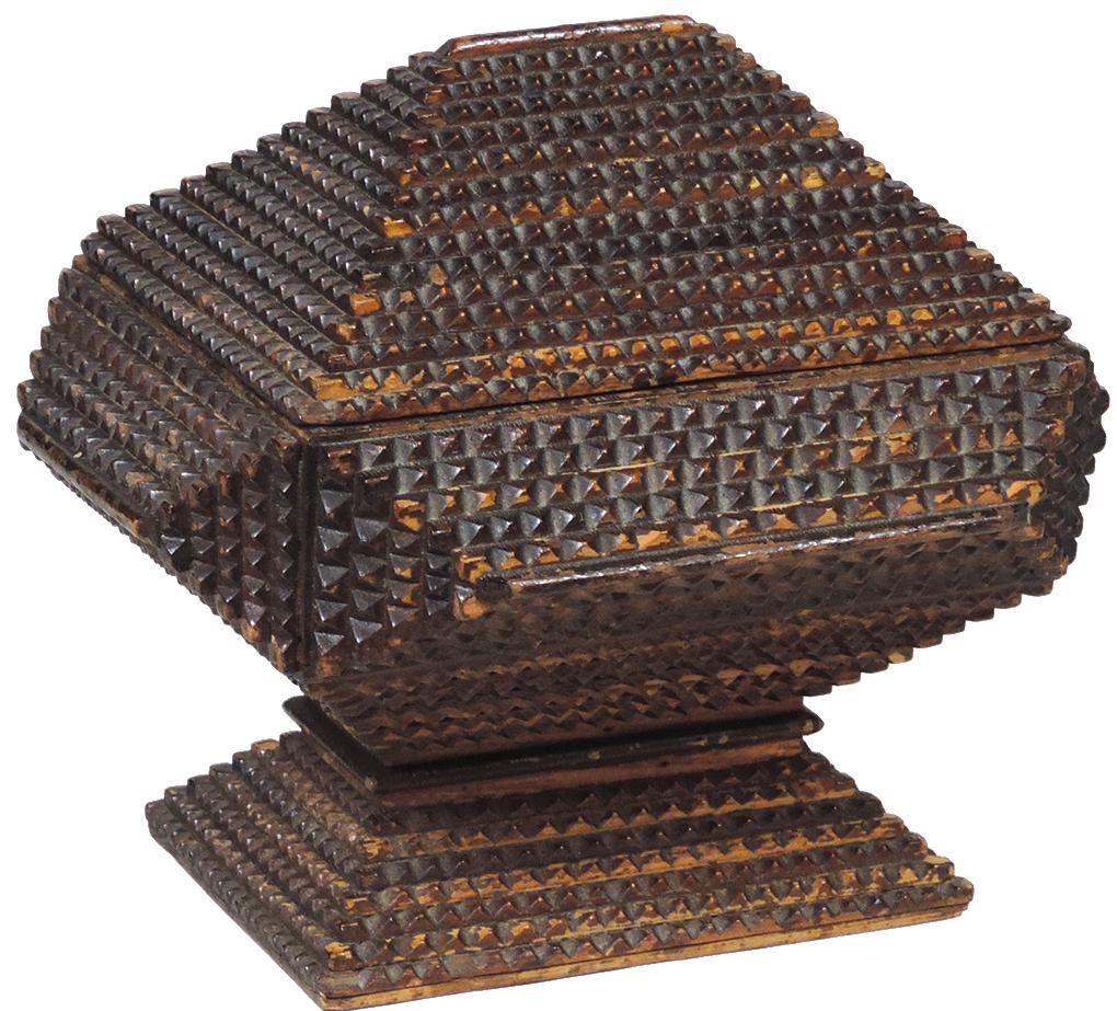 Tramp Art Box, chip carved Folk Art layered wood hinged: Tramp Art Box, chip carved Folk Art layered wood hinged box on pedestal base w/divided interior, VG cond w/edge wear & some finish flaking, 8"H x 9"W x 7.5"D.