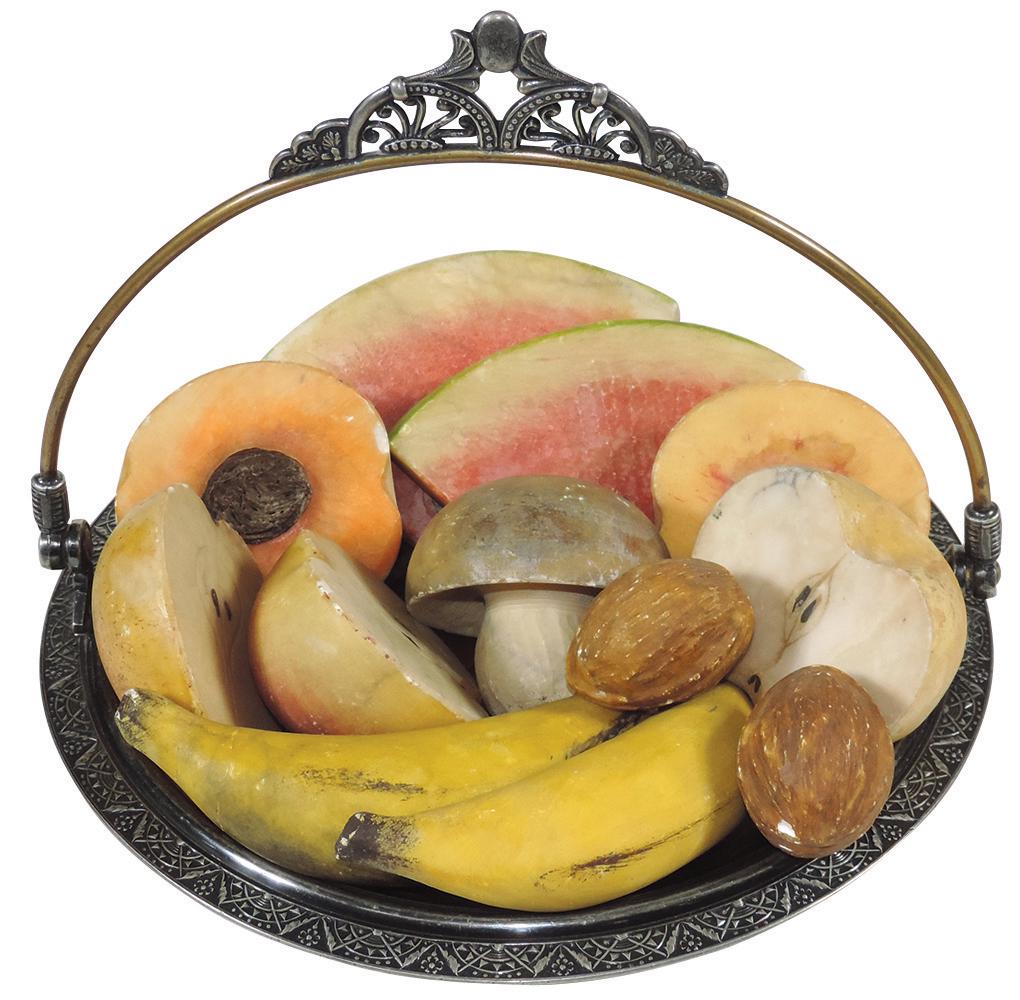 Victorian Table Setting (13), Stone Fruit on a: Victorian Table Setting (13), Stone Fruit on a Pairpoint quadruple-plate basket, carved & polychrome stone fruit (2 of each) bananas, watermelon slices, split apple, peach, walnuts & 1 pear slice & mu