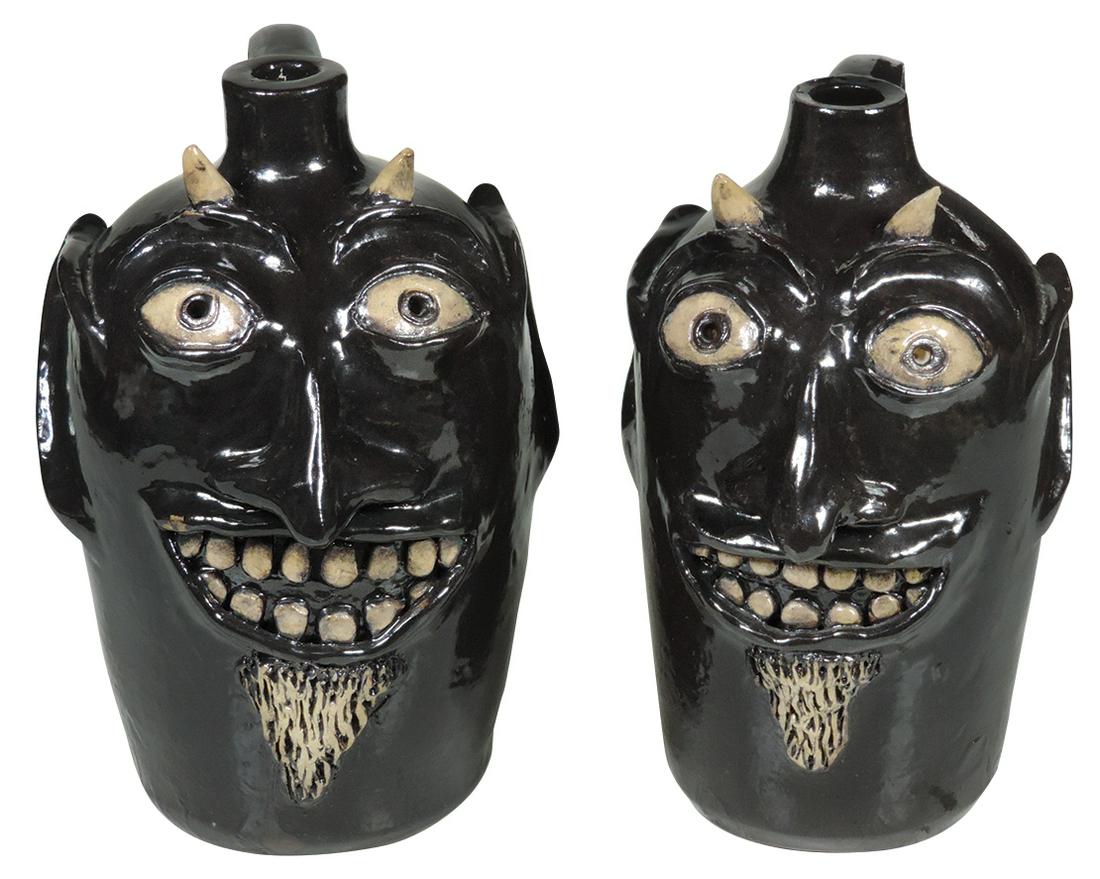 Folk Art Face Jugs (2), by Master Potter Robert J.: Folk Art Face Jugs (2), by Master Potter Robert J. Jackson-Jackson Pottery-Rock Island, IL, brown glazed Grotesque Devil's faces, both impressed "Jackson Pottery" & inscribed "Robert J. Jackson" on ba