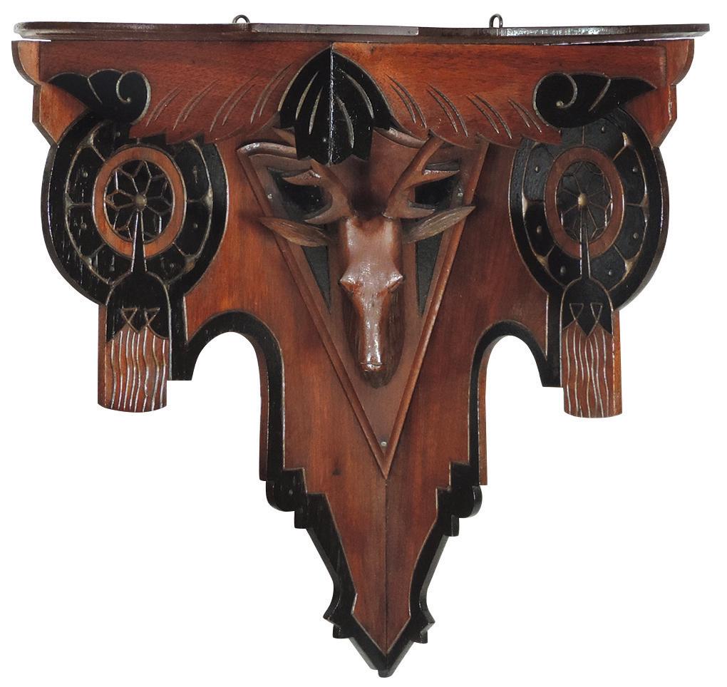 Victorian Eastlake Carved Deer Head Corner Shelf,: Victorian Eastlake Carved Deer Head Corner Shelf, walnut ebonized rosettes, the mount w/glass eyes, VG to Exc cond w/orig finish, 18"H x 12"W x 12"D.