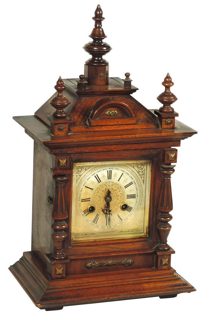Clock, Junghans Bracket Clock, made in Germany, Early: Clock, Junghans Bracket Clock, made in Germany, Early 20th Century, walnut architectural form case w/turned finials & brass mounts, Good orig cond & finish, pendulum & gong bell absent, 18.5"H x 11"W 
