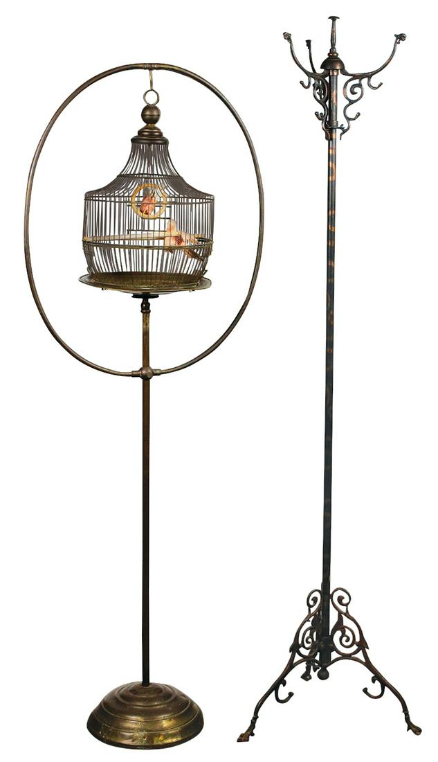 Decorative Metalwares (2), c.1900, Hendryx brass: Decorative Metalwares (2), c.1900, Hendryx brass birdcage on adjustable floor stand w/accessory table base stand & an iron hall tree w/copper-flashed finish & griffin head terminals, VG to Exc cond w/