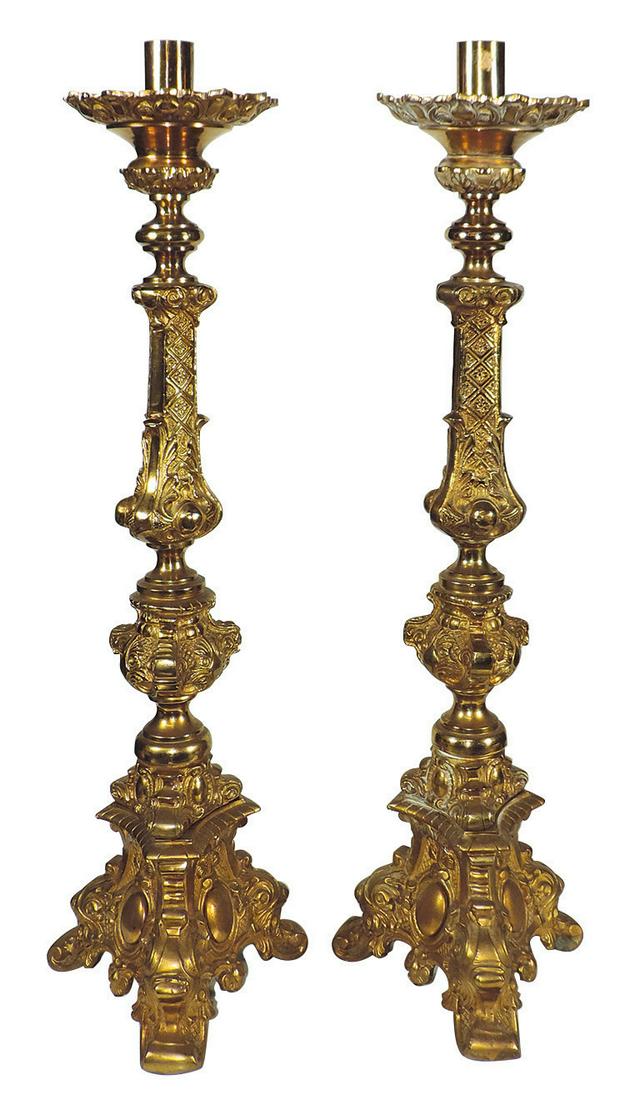 Lighting, Pair of Rococo-style gilt bronze: Lighting, Pair of Rococo-style gilt bronze alter stands of sectional form w/3-footed bases, likely Mid 20th Century, VG cond w/some wear & oxidation, 32"H x 9"W.