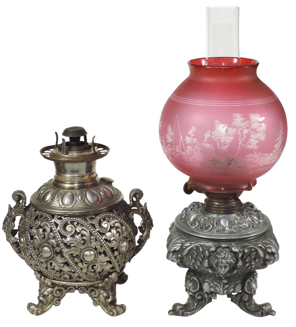 Lighting (2), Victorian Renaissance Revival Oil Lamps,: Lighting (2), Victorian Renaissance Revival Oil Lamps, Bradley & Hubbard silvered metal w/pierced foliate base & Man of the North handles & a Duplex w/lion heads & intaglio etched shade,each with 4" s