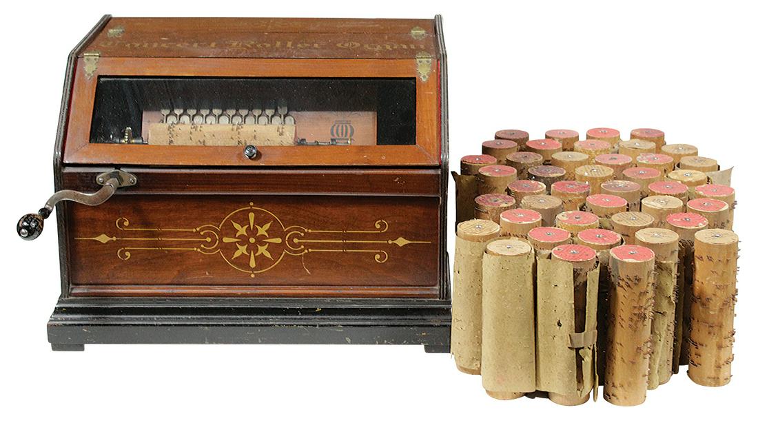 Musical, Concert Roller Organ, c.1880's, walnut: Musical, Concert Roller Organ, c.1880's, walnut w/ebonized base & gilt decoration, hand crank pneumatic organ w/43 removable steel pinned wood cylinders or cobs, VG cond, plays well w/a couple of stic