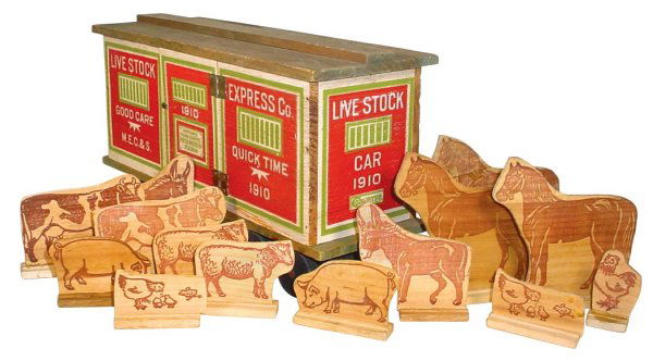 Toy, train car, Livestock Express Co., Converse,: Toy, train car, Livestock Express Co., Converse, M.E.C. & S., 1910, wood w/advertising on all sides, comes w/14 wooden animals, a great early wooden toy in Exc cond, 8.5"H x 14.5"L.