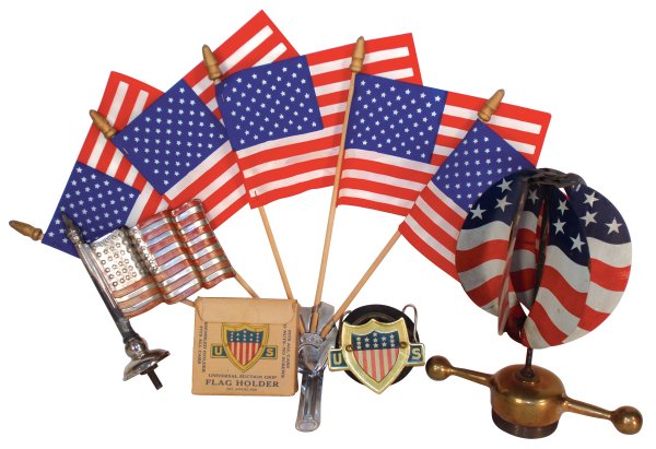 Automobile hood ornaments (4), one w/spinning fla: Automobile hood ornaments (4), one w/spinning flags w/radiator cap, 8"H, flag holder w/5 flags, 11"H, nickel-plated steel ornament w/48 star flag, 5.5"H & New Columbia flag holder in orig box, 2.5"H,