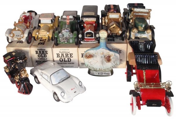 Liquor decanters (10), Locomotive, c.1960, Dino F: Liquor decanters (10), Locomotive, c.1960, Dino Ferrari, c.1975, Monument to the South, c.1974, Ford Runabout, c.1978, 1911 Stanley Steamer, c.1971, 1913 Cadillac, c.1971, 1915 Pierce Arrow, c.1971, 1