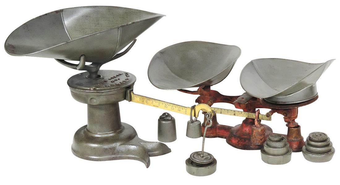 Country Store Iron Scales (2), cast iron counter: Country Store Iron Scales (2), cast iron counter scales, larger one mfgd by "Howe & Co.", and includes weights as shown. VG to Exc cond, 14.5"L.