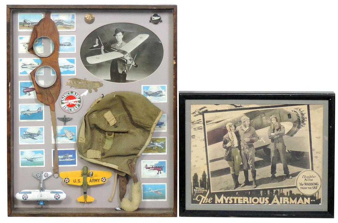 Aviation Displays (2), shadow box containing: Aviation Displays (2), shadow box containing attractively arranged group of aviation cigarette cards, canvas flying helmet & goggles, photo of man w/model plane & other items plus a framed lobby card 