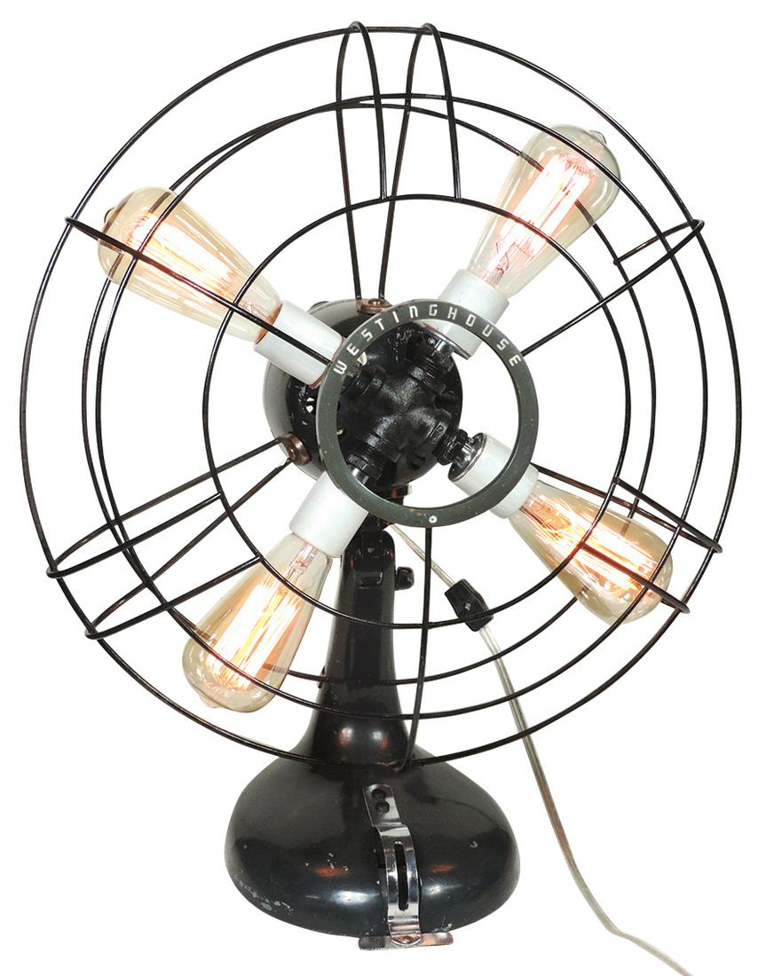 Industrial Design, Steampunk Rotary Table Lamp, housed: Industrial Design, Steampunk Rotary Table Lamp, housed in a Westinghouse fan case & stand w/cage, 4-light w/Edison bulbs, prof conversion w/orig paint retaining natural distress, Exc "like new" cond,