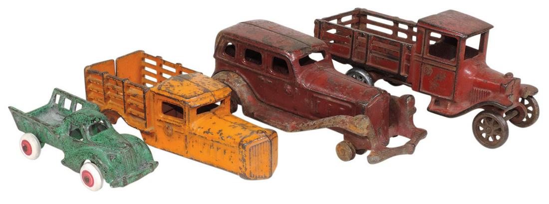 Toy Vehicles (4), Arcade large & small stake trucks &: Toy Vehicles (4), Arcade large & small stake trucks & A.C. Williams interchangeable sedan & stake box body, all cast iron, most all in Good cond w/wear, stake truck & chassis missing wheels, largest 7