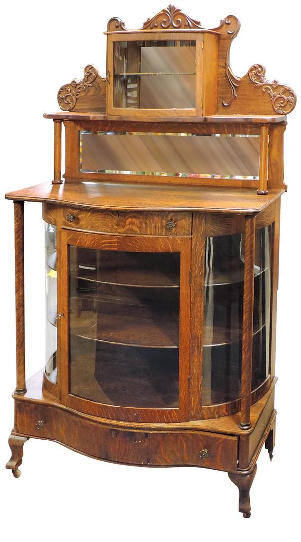 Victorian Curved Glass China Cabinet, oak, bow front: Victorian Curved Glass China Cabinet, oak, bow front glass door w/curved glass side panels, later added carved back panel & upper curio, VG+ refinished cond, 74"H x 44"W x 19"D.