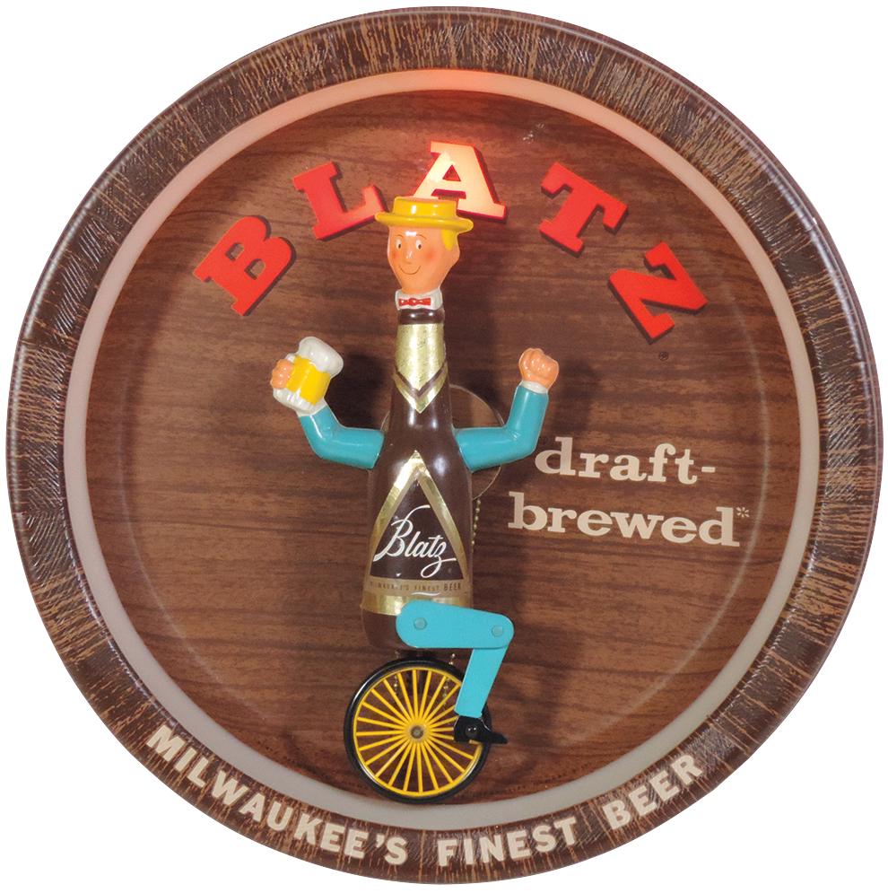 Breweriana Sign, Blatz Beer Unicycle w/animated motion,: Breweriana Sign, Blatz Beer Unicycle w/animated motion, molded plastic w/bottle figure that cycles around lighted barrel, Exc cond, 19"Dia. x 5.5"D.