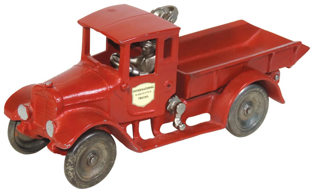 Toy Truck, International "Red Baby" Dump Truck, cast: Toy Truck, International "Red Baby" Dump Truck, cast iron, mfgd by Arcade, c.1920s, Exc cond w/older repaint noting crank latch absent, 4.5"H x 10.5"W.